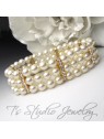 Three Strand Ivory Pearl Bracelet with Gold Rhinestone Spacers Three Strand Ivory Pearl Bracelet with Gold Rhinestone Spacers